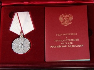 Путин наградил директора департамента 