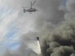 Вертолеты закончили работу на месте пожара в подмосковном Дзержинском