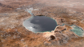 Так мог выглядеть марсианский кратер Езеро несколько миллиардов лет назад. В древности он был заполнен водой, и учёные возлагают большие надежды на поиски в его окрестностях признаков былой жизни.